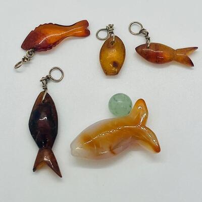 Lot 181: Amber & Jade Fish Charms