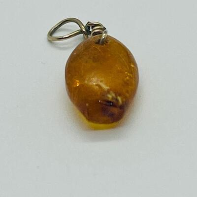 Lot 181: Amber & Jade Fish Charms
