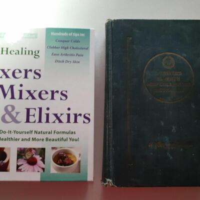 1 home remedy book and 1 websters dictionary from