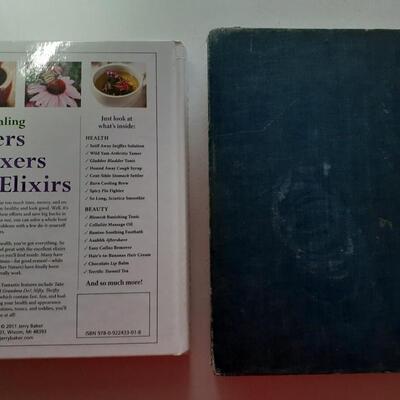 1 home remedy book and 1 websters dictionary from