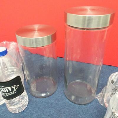 LOT 481  TWO GLASS CANISTERS AND PLASTIC CUPS
