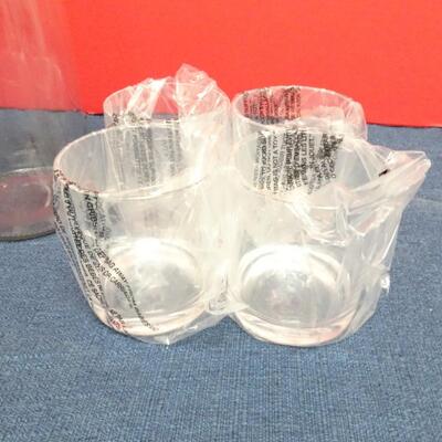 LOT 481  TWO GLASS CANISTERS AND PLASTIC CUPS