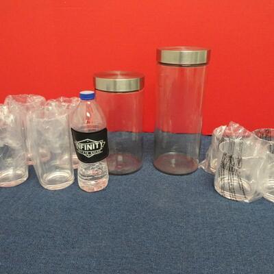 LOT 481  TWO GLASS CANISTERS AND PLASTIC CUPS