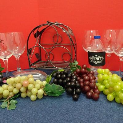 LOT 503  TABLE TOP WINE BOTTLE RACK, WINE GLASSES AND RUBBER GRAPES