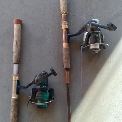 LOT 231  TWO FISHING POLES AND REELS