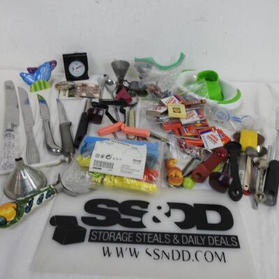 Kitchen items: knives, canning funnel, chip clips, matches, nut cracker, magnets