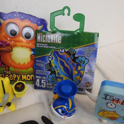 Toy lot: watches 1 works, puzzle, Paw Patrol stickers, sunglasses, headphones