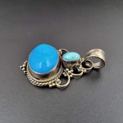 925 STERLING SILVER ORNATE PENDANT W/ BLUE STONE