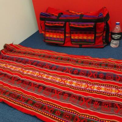 LOT 554. TABLE CLOTH AND DUFFLE BAG