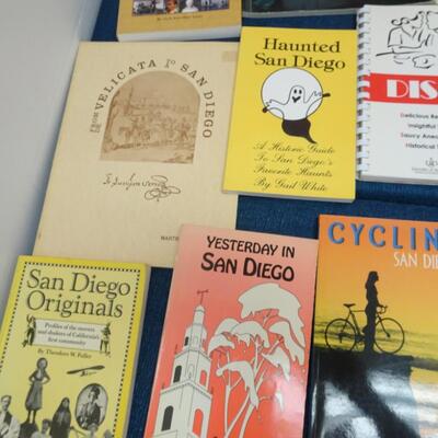 LOT 557. COLLECTION OF SAN DIEGO RELATED BOOKS AND CALENDAR