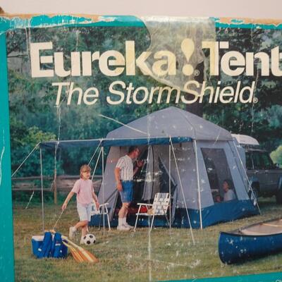 LOT 560 EUREKA STORM SHIELD SUV TENT