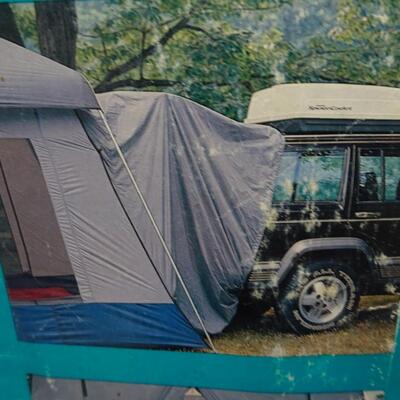 LOT 560 EUREKA STORM SHIELD SUV TENT