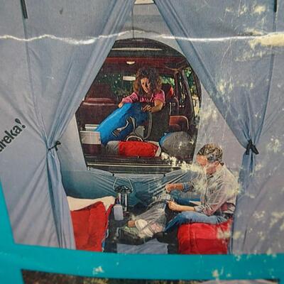 LOT 560 EUREKA STORM SHIELD SUV TENT
