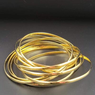 GOLD TONED INTERLOCKING BANGLE BRACELET