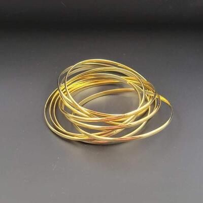 GOLD TONED INTERLOCKING BANGLE BRACELET