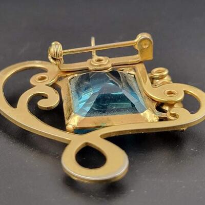 RHINESTONE & GOLD TONED BROOCH W/ BLUE GEM
