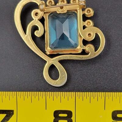 RHINESTONE & GOLD TONED BROOCH W/ BLUE GEM