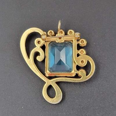 RHINESTONE & GOLD TONED BROOCH W/ BLUE GEM