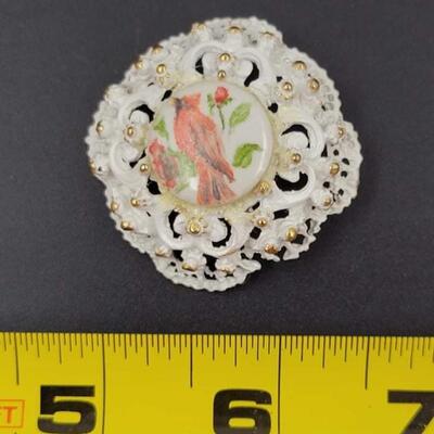 WHITE & GOLD METAL BROOCH W/ CERAMIC CARDINAL CENTER