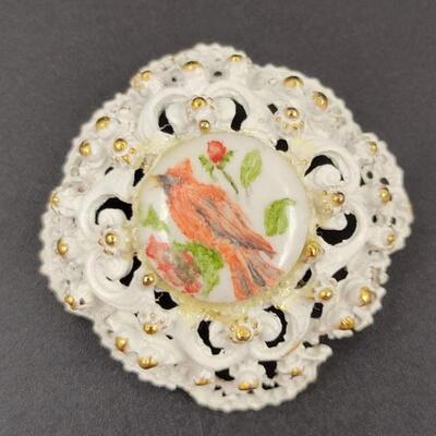 WHITE & GOLD METAL BROOCH W/ CERAMIC CARDINAL CENTER