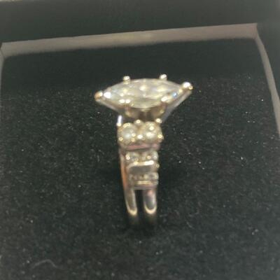 1 + carat Marquis Diamond center  Stone with 12 additional cut diamonds in 14k gold.
