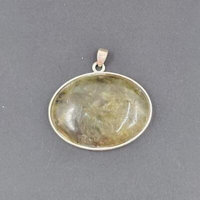 SILVER TONED OVAL PENDANT W/ RESIN STONE