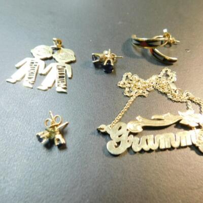 Collection of 14K Gold Jewelry Includes Earring Sets, GRANNY Necklace Pendant, and Charm Approximately 16 Grams