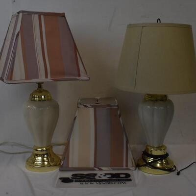 2 lamps with shades, 1 extra shade, lamp colors: cream nd white w/gold trim