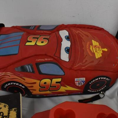 Kitchen lot: Wilton, Lightning McQueen lunch box, plastic bag keeper, cook books