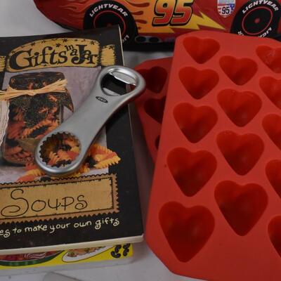 Kitchen lot: Wilton, Lightning McQueen lunch box, plastic bag keeper, cook books