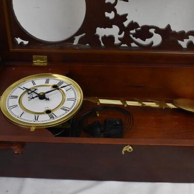 Wood  32 in tall working Grandfather clock w/key, hanging, mahogany colored wood