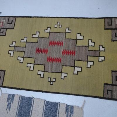 LOT 562. TWO SMALL NAVAJO RUGS