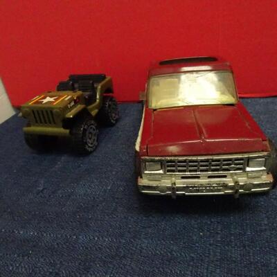 LOT 625 TOY TRUCKS AND BOAT
