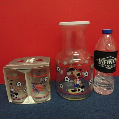 LOT 629.   1984 WORLD CUP  USA LIBBEY JUICE GLASSES AND JUICE CONTAINER