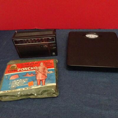 LOT 630. VINTAGE GE PORTABLE RADIO, SCALE AND VINTAGE PONCHO