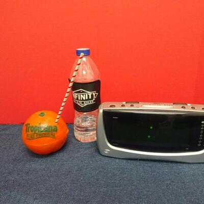LOT 563 TROPICANA ORANGE RADIO AND CLOCK RADIO