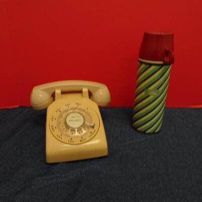 LOT 568. VINTAGE DIAL PHONE AND THERMOS
