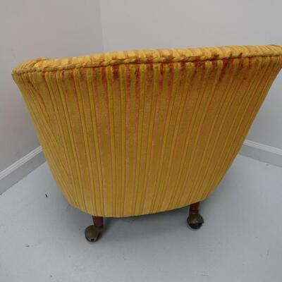 LOT 603. VINTAGE CHAIR ON CASTERS