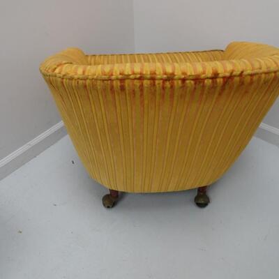 LOT 603. VINTAGE CHAIR ON CASTERS