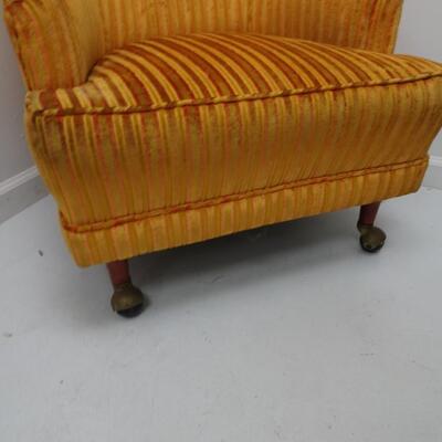 LOT 603. VINTAGE CHAIR ON CASTERS