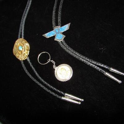 LOT 10  TWO BOLO NECKTIES AND A SACAGAWEA REPRODUCTION COIN KEYCHAIN