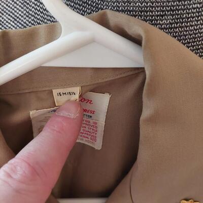 Vintage  military uniform with metal  cluster.