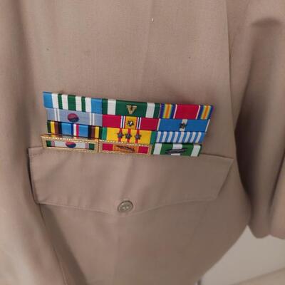 Vintage  military uniform with metal  cluster.