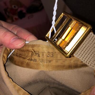 Vintage  military uniform with metal  cluster.