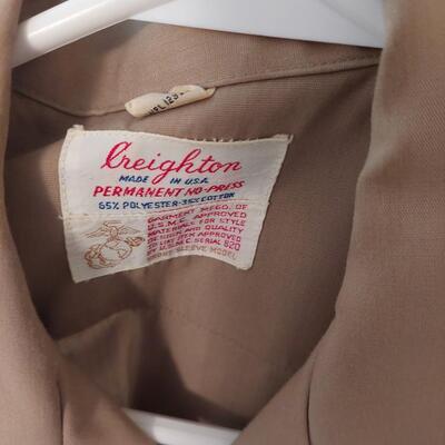 Vintage  military uniform with metal  cluster.