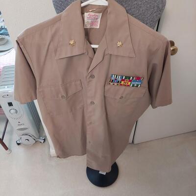 Vintage  military uniform with metal  cluster.