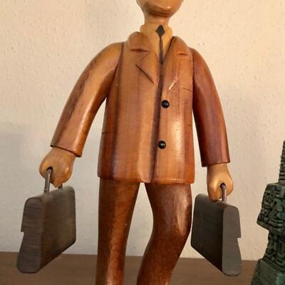 Hand carved business man by Romer