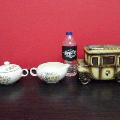 LOT 635. CREAMER SUGAR SET AND  PORCELAIN CARRIAGE