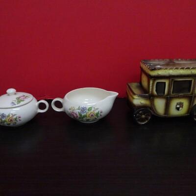 LOT 635. CREAMER SUGAR SET AND  PORCELAIN CARRIAGE