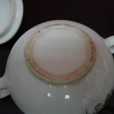 LOT 635. CREAMER SUGAR SET AND  PORCELAIN CARRIAGE